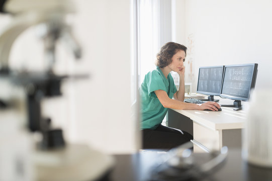 Female technician working on computer