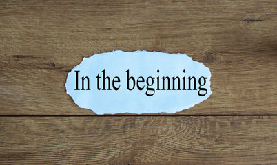 Words 'in the beginning' on the piece of paper.