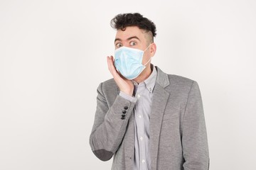 Surprise astonished handsome guy. Closeup portrait of man looking surprised in full disbelief wide open mouth with hand near face. Positive emotion facial expression body language. Funny boy