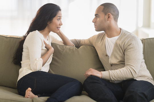 Young couple sitting on couch