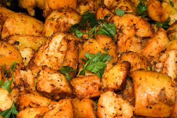 Baked potato wedges with cheese.