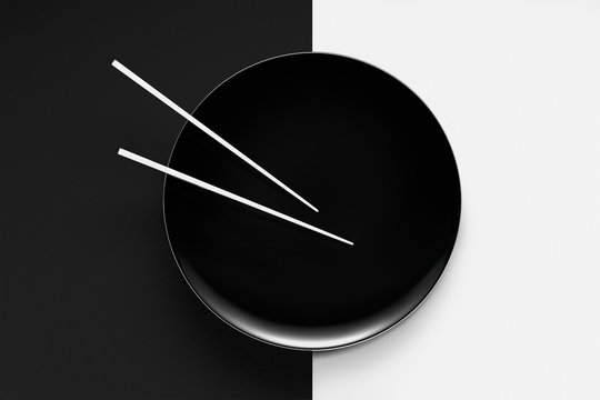 Empty plate with chopsticks