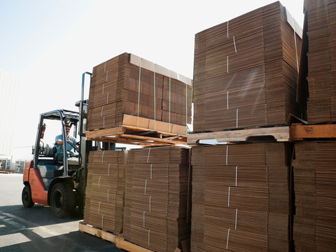 Forklift truck moving pallets
