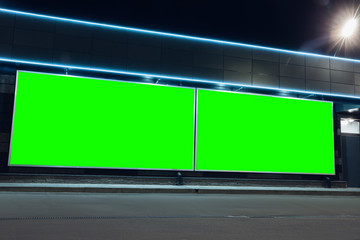 Blank citylight for advertising on the building at city, copyspace for your text, image, design. Media marketing, ads, promo announcement, commercial propose or message. Banner, template chromakey.