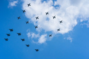 A group of professional pilots of military aircraft in sky. 