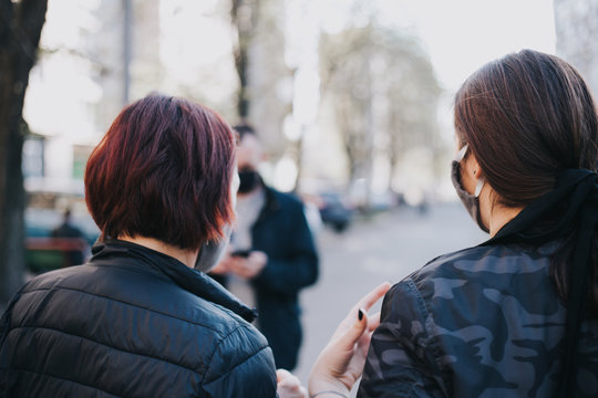 Two Women From Behind On The Street Walking In Protective Mask (coronavirus, Covid-19)