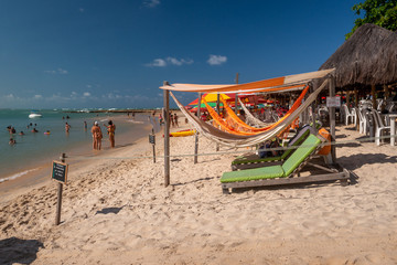 Beach in Tibau do sul, near Pipa beach and Natal, Rio Grande do Norte, Brazil on September 25, 2016. Hammocks and beach chairs