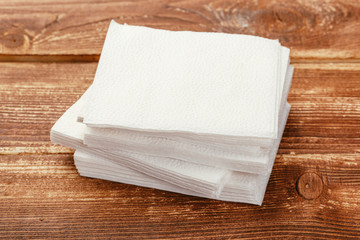 white paper napkin with a textured pattern on an old table