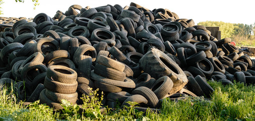 Large pile of used old, black tires