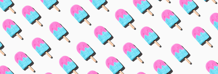 Pink and blue popsicles with shadow - overhead view