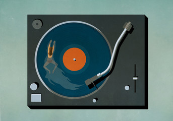 Woman swimming in vinyl record player