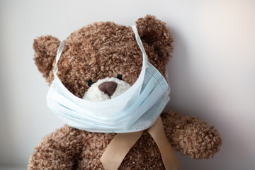 A teddy bear with a mask on its face