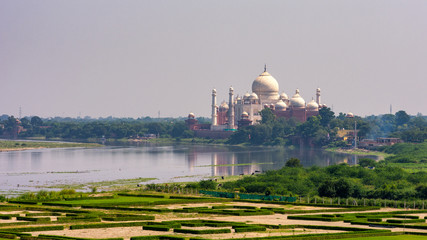 Distant view of the Taj Mahal mausoleum next to the Yamuna river in, Agra, India