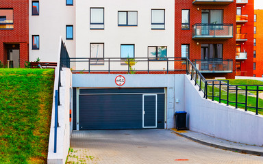 Modern residential apartment home building architecture with garage reflex