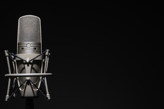 Professional, studio microphone on a black background. Is isolated..Can be used for audio, karaoke and music content.