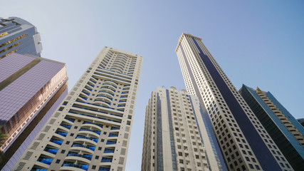 Fototapeta premium Tall and modern skyscrapers of Dubai on a sunny day.