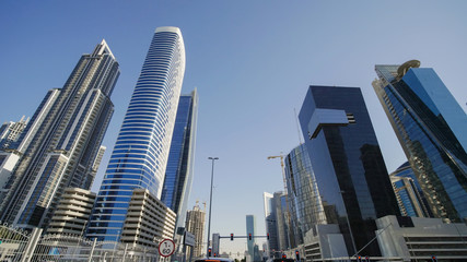 Fototapeta na wymiar Tall and modern skyscrapers of Dubai on a sunny day.