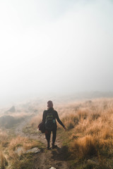 woman hiking in fog 