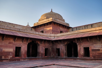 Old red sandstone palace at the Mughal city of Fatehpur Sikri in Agra, India