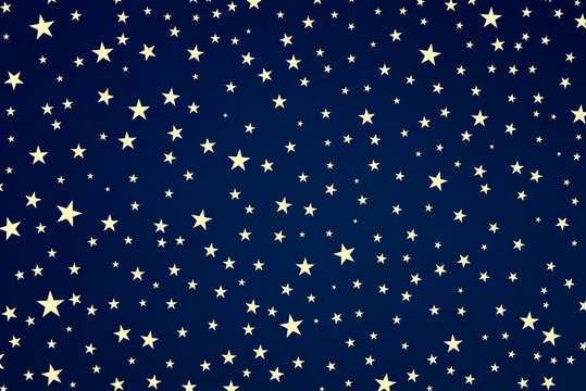 Blue stars background, white star shapes on phantom or navy blue color in starry night sky design, July 4th, memorial day, veterans day, or patriotic USA graphic art for projects and backgrounds