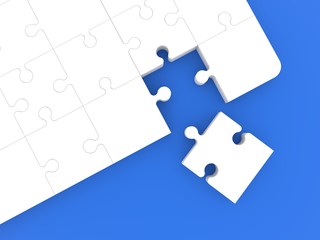 A piece of white puzzle next to an unfinished white puzzle on a blue background