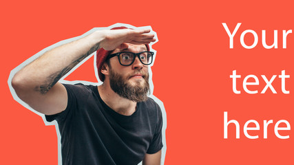 Crazy hipster guy pointing with fingers at your text or product. Crazy hipster guy emotions....