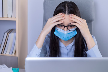 Exhausted businesswoman working during the coronavirus pandemic