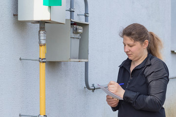 The girl the peasant woman will check on the wall and write down the gas meter in a notebook....