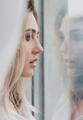 Beautiful woman by the window.
