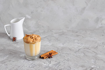 Homemade Dalgona coffee in glass, popular Korean drink latte