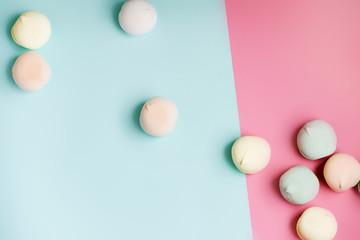 Homemade sweet colored meringue on white background. Dessert.