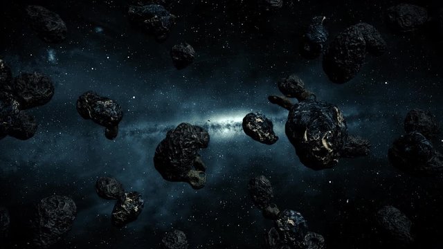 Flying into an asteroid belt in outer space.
