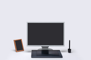 Blank screen computer monitor with touchpad on white background