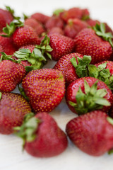 Fresh strawberries on the white  background. Vertical photo