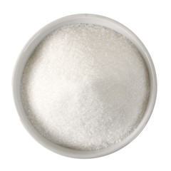 White ceramic bowl with sugar on white background