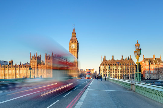 Double-decker bus passes on Westminster Bridge, in front of Westminster Palace and clock tower of Big Ben (Elizabeth Tower), London, England, United Kingdom