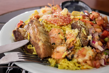 dish made with paella, seafood and cutlery for consumption