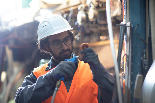 young store worker cleaning a tool