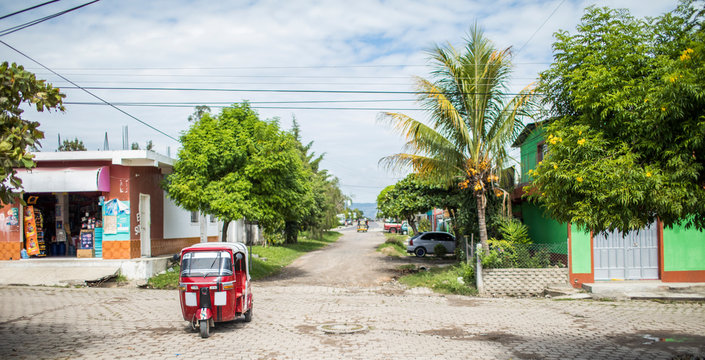 Tuk tuk driving on street in Monjas, Guatemala
