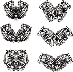 Ornate butterfly wings in black and white tones. Unusual abstract butterflies on a white background for cards, textile, tattoo, embroidery, decorative compositions, etc.