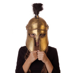 Emotional teenager girl in historical copy helmet Spartan warrior on a white background