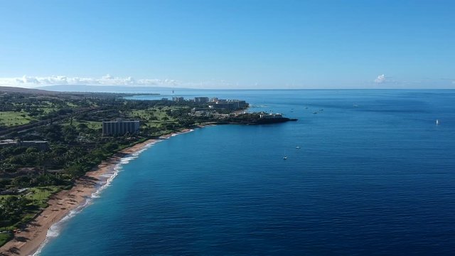 Aerial footage of North Ka'anapali beach looking towards the famous Black Rock and the town of Lahaina