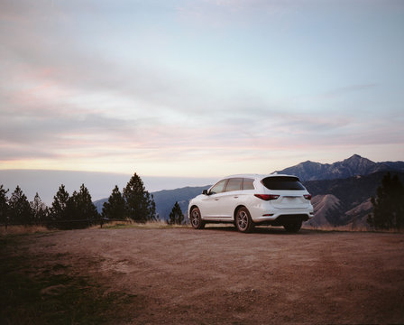Car parked on hills overlooking Big Sur coastline