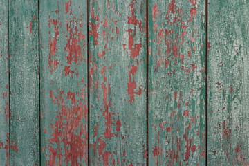 Green with red textured background with painted cracked wood
