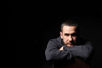 picture of a man on a black background in black clothes