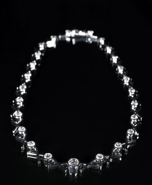 diamond necklace on black background