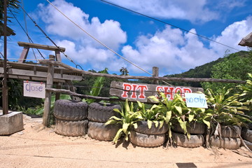 the "closed" sign is hanging on a rope against the background of beautiful signage