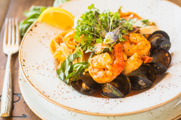 seafood fettuccine with sauteed white prawns, mussels and fish
