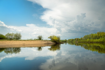 Changeable weather on the river on a spring day