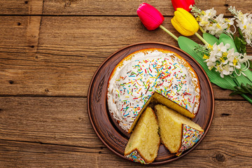 Easter cake on old wooden table. Traditional Orthodox festive bread
